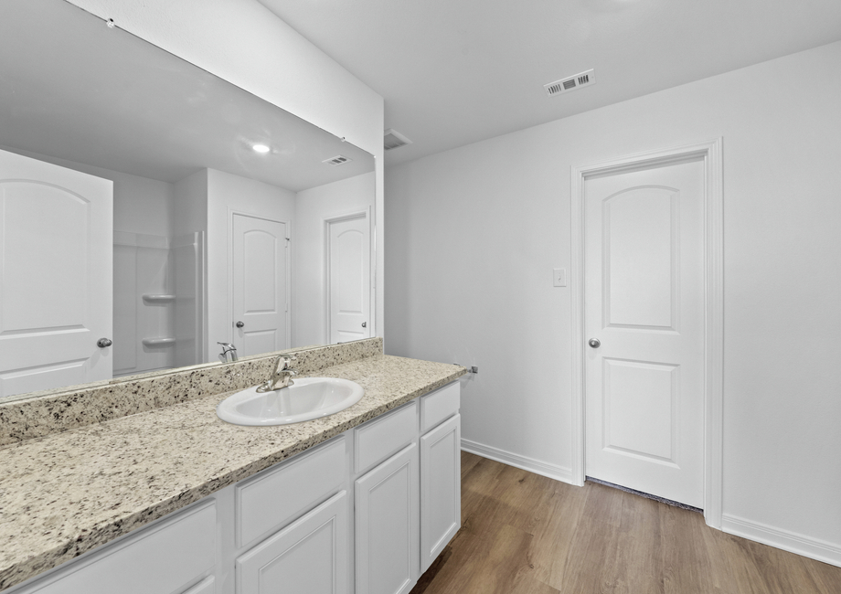 Large granite vanity in the master bathroom