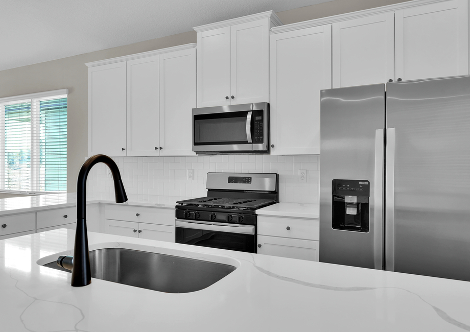 Each kitchen includes stainless steel appliances