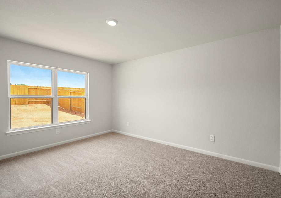 The master bedroom has a large window.
