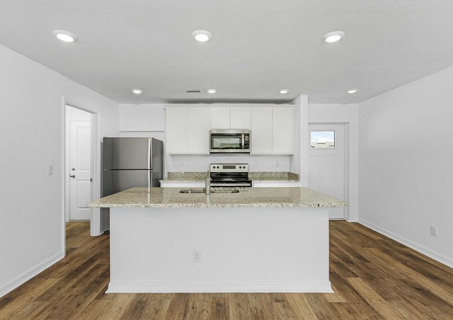 Perfect for chefs of all skill levels, The Marco's kitchen includes an island and stainless steel appliances