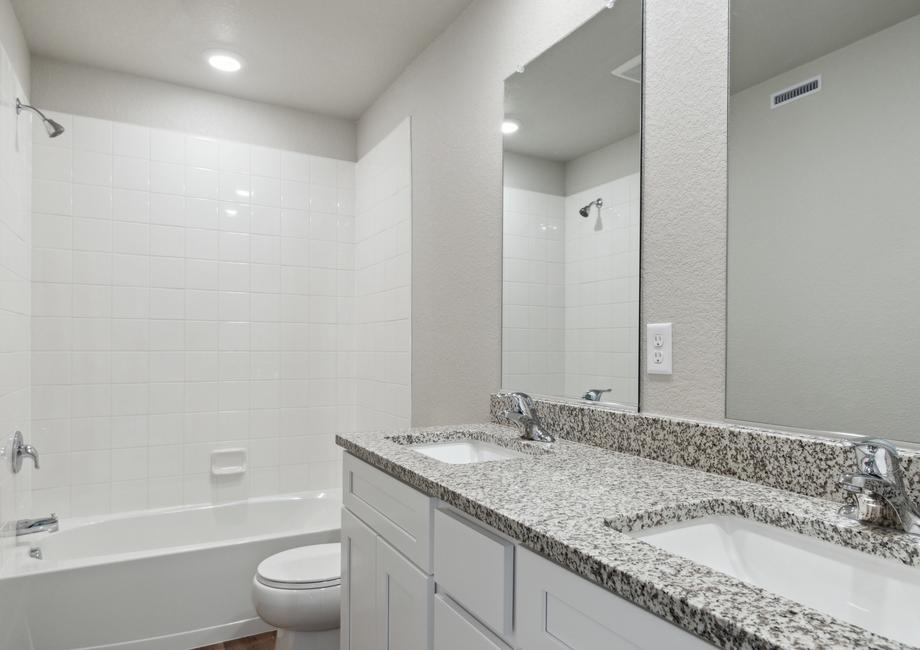 The secondary bathroom in the Platte has dual sinks and a shower-tub combo.