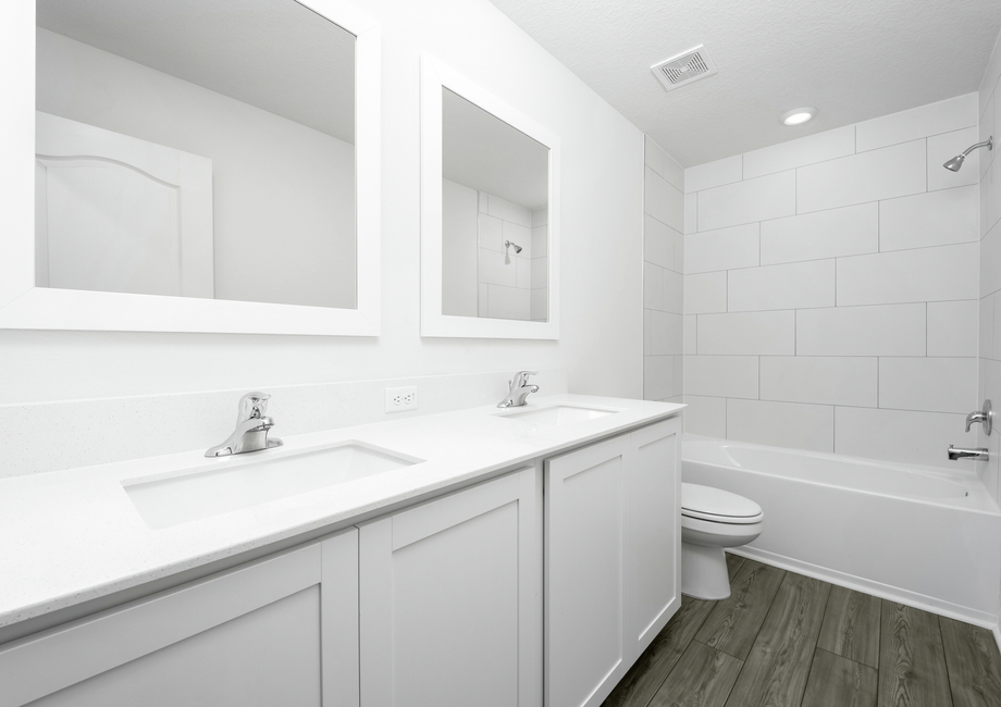 Upstairs bathroom with two sinks