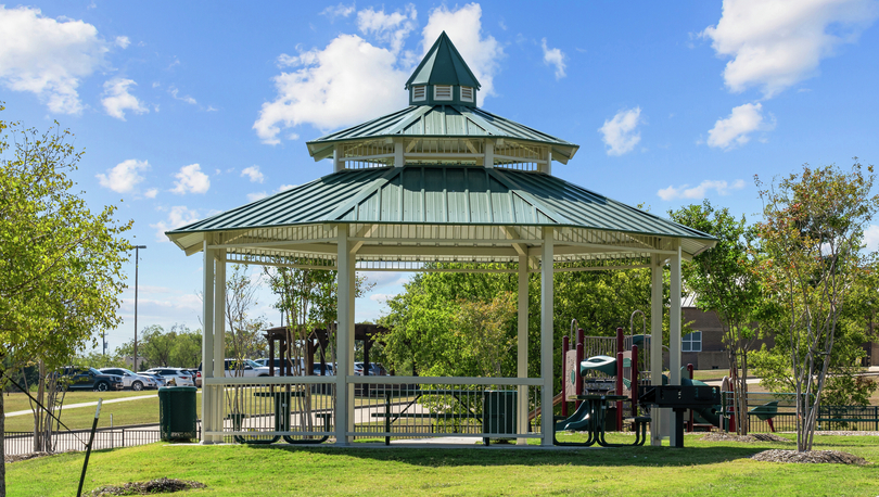 The gazebo at the park provides shade and seating.