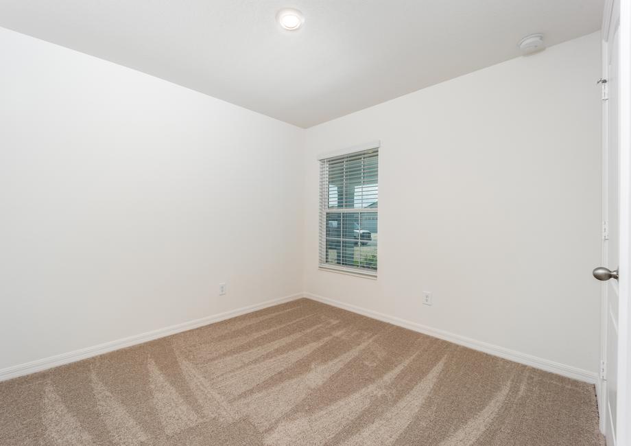 The third bedroom has a window that faces the front yard