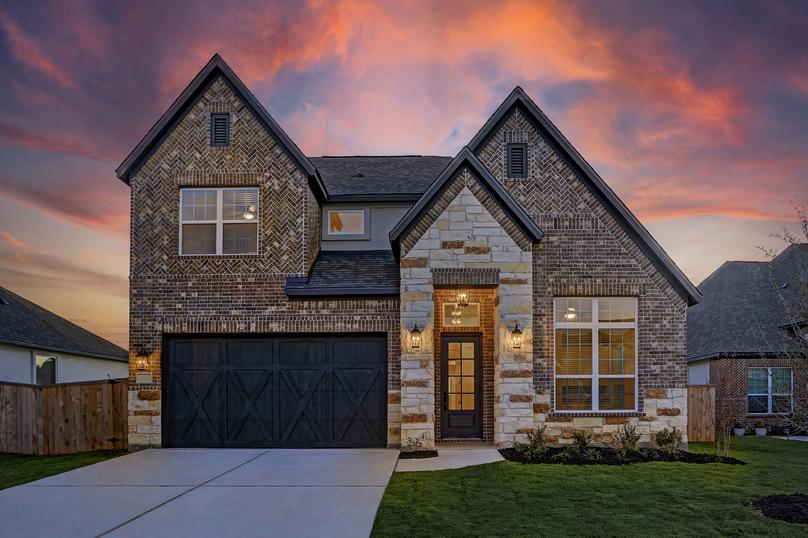 Dusk exterior of the Saurel plan, showcasing the exceptional exterior appeal.