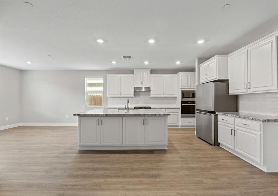 Enjoy stunning granite countertops and a bright white, spacious kitchen.