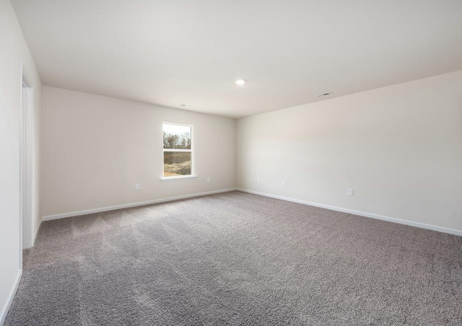 Rest and relaxation awaits in this spacious master bedroom