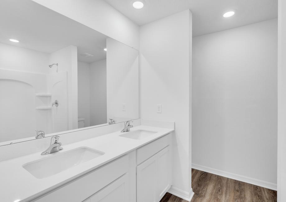 Prepare for your day in this beautiful master bathroom with dual sinks as well as a dual bathtub and shower