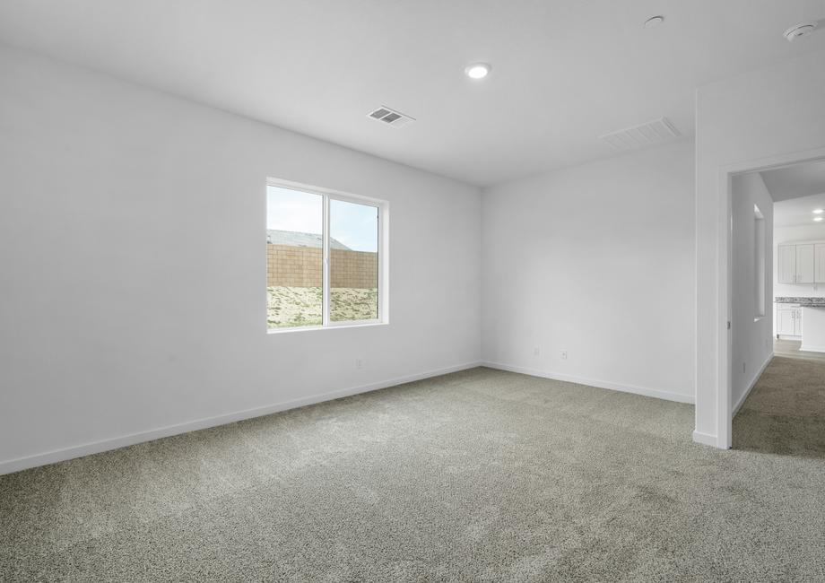 The master bedroom is spacious with a large window.