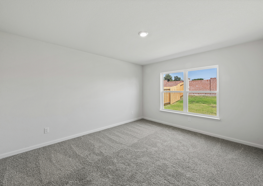 The master bedroom has a large window that lets in great, natural light.