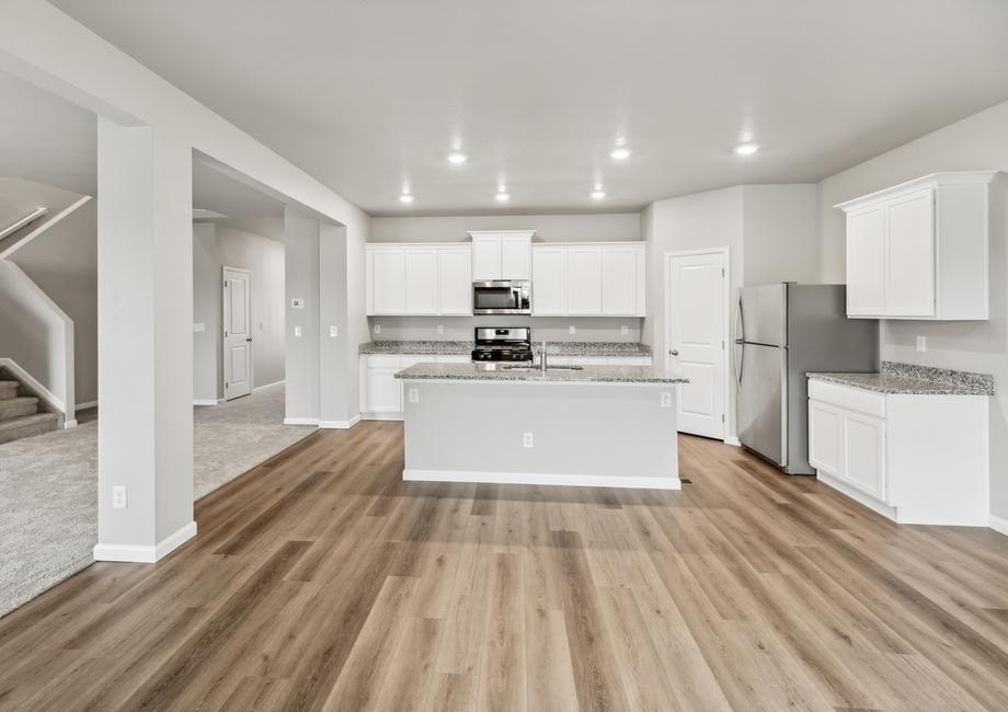 The kitchen overlooks the dining area, ensuring you don't miss a beat while making dinner.