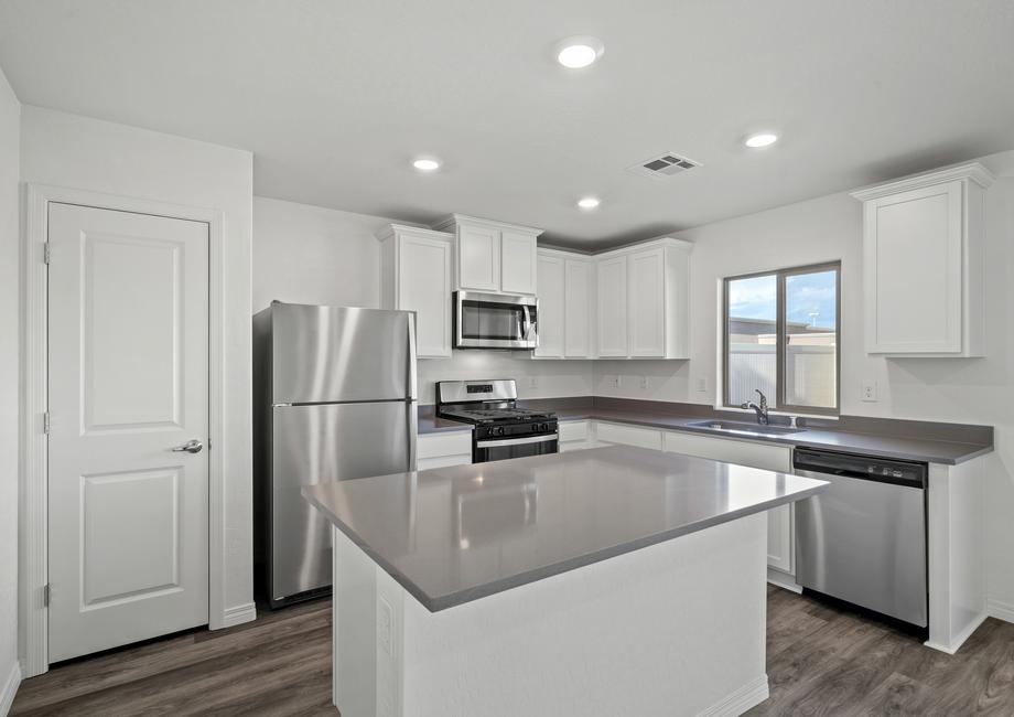 Kitchen with stainless steel appliances and plank flooring