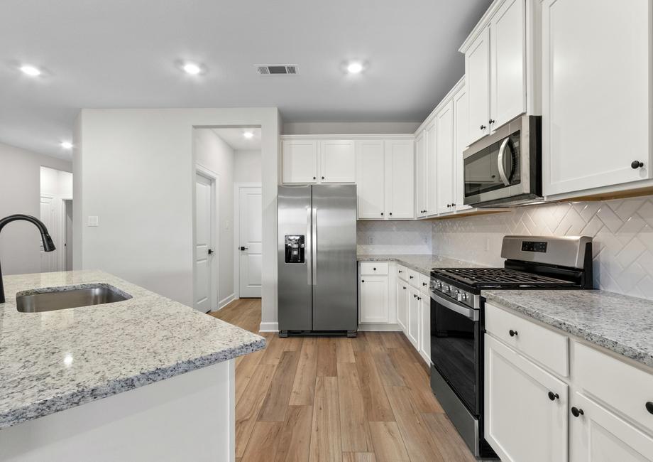 Both the kitchen and dining room overlook the spacious backyard.