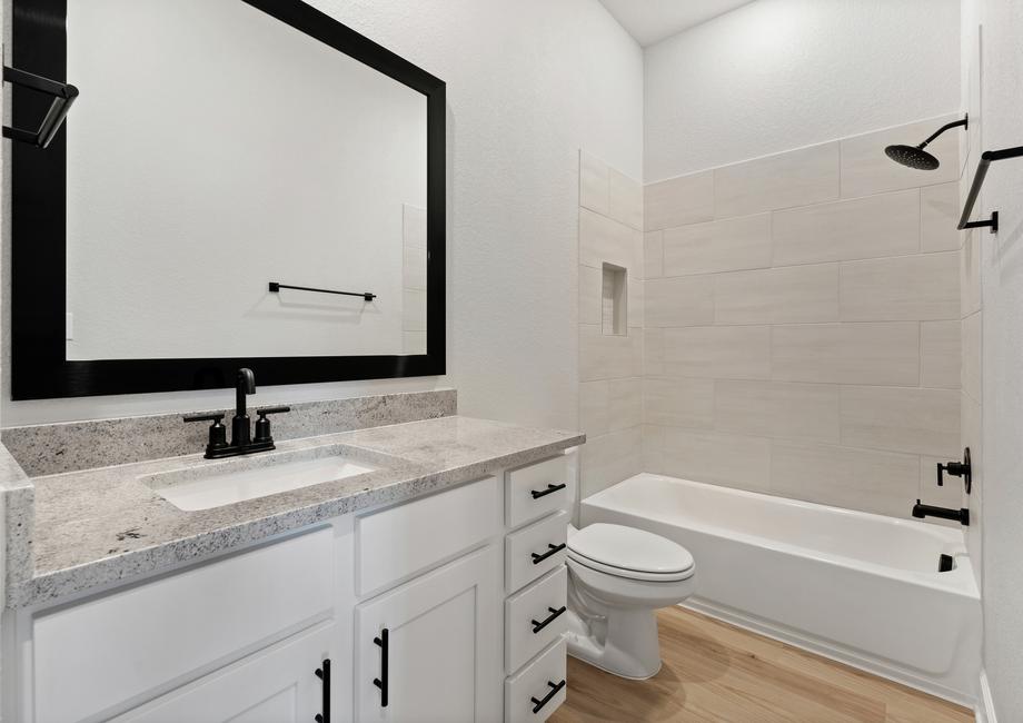 The secondary bathrooms offer plenty of storage.