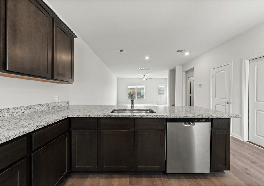 The kitchen of the Driftwood has sprawling granite countertops.