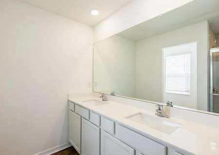 The master bathroom has a large vanity for you to get ready