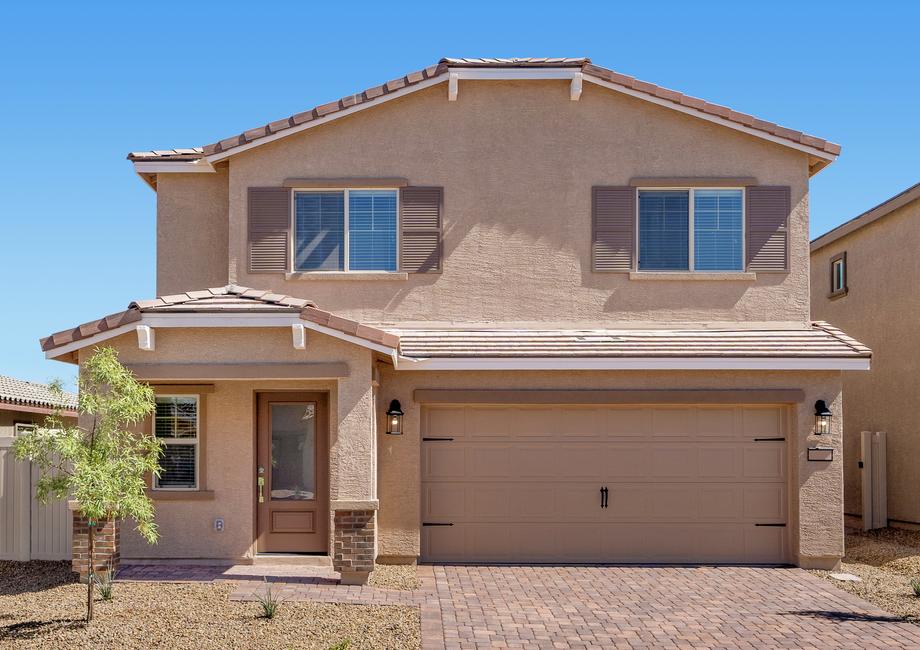 The Stella is a beautiful two story home with stucco and brick.