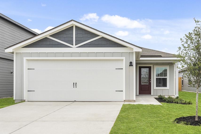 Exterior of the Hawthorne plan with professional front yard landscaping.