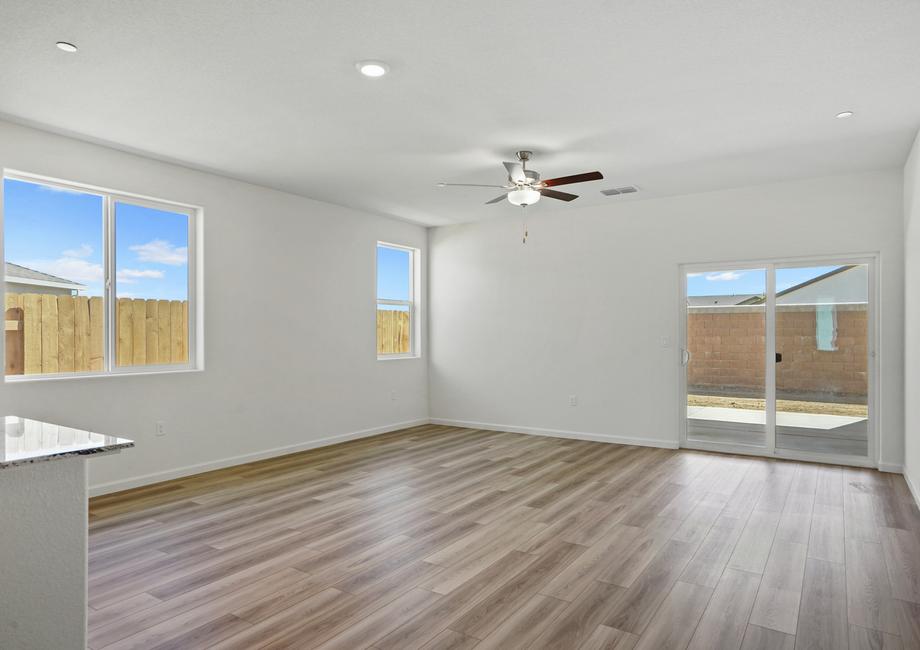 Natural light and beautiful wood flooring in the living area