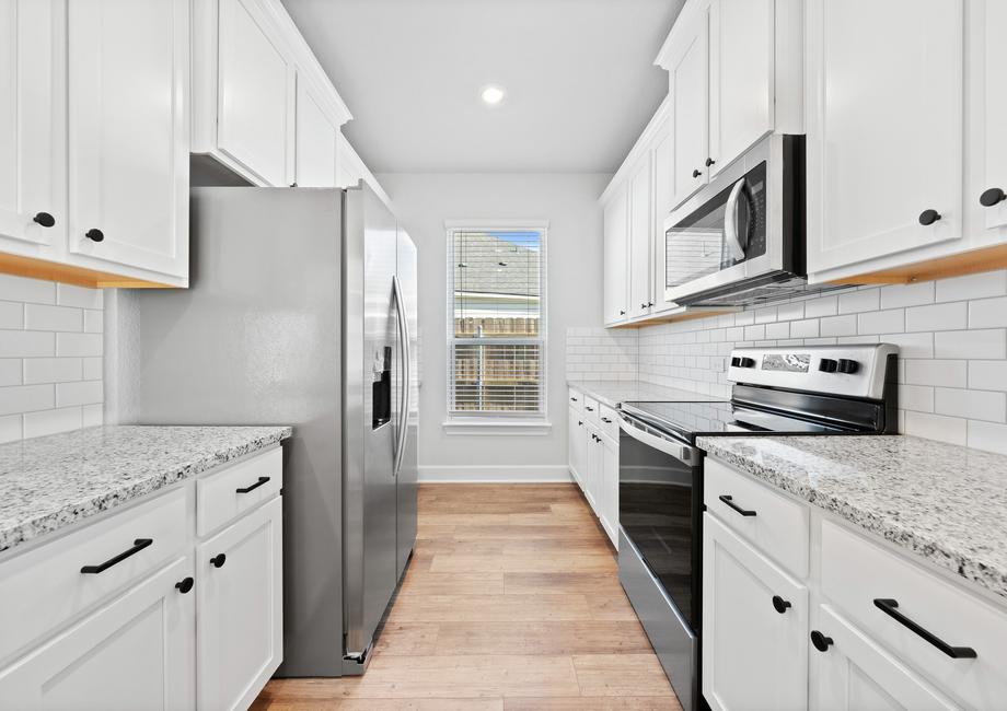 Ample counterspace to prepare decadent meals featuring stainless steel Whirlpool appliances.