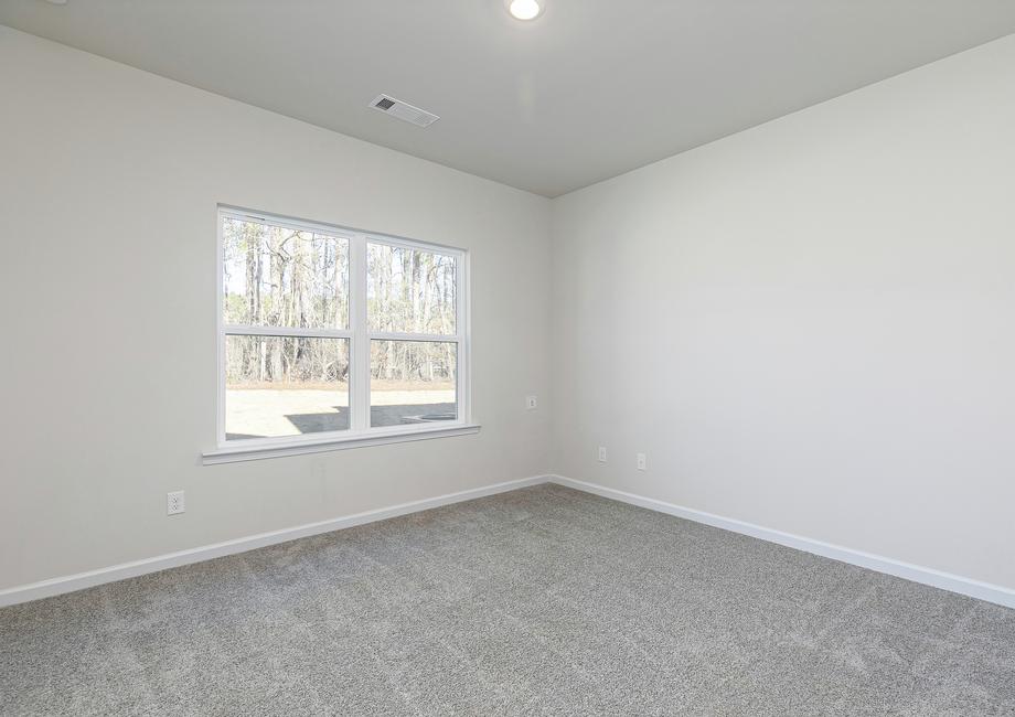 Unwind after a long day in the gorgeous master bedroom