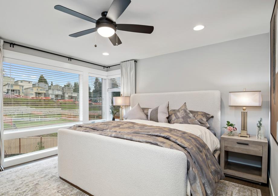 The master bedroom has stunning windows.