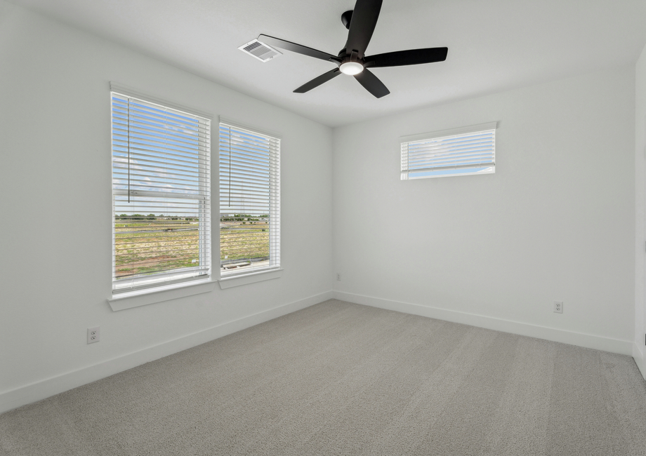 Cozy secondary bedrooms are found throughout the home.