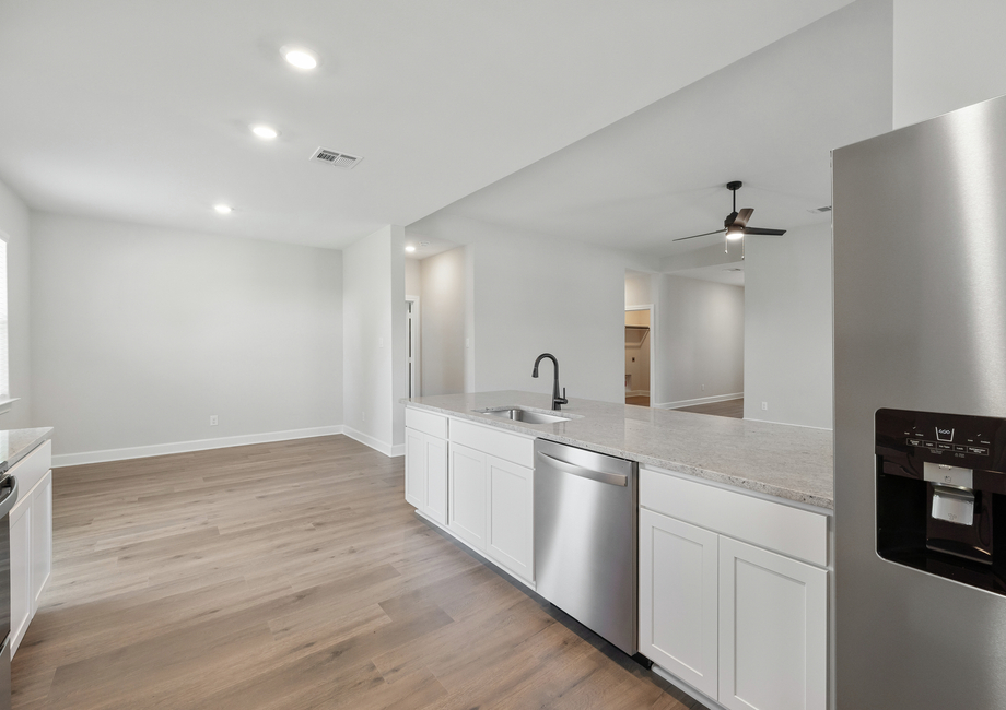 The kitchen of the Reed floor plan has sprawling granite countertops.