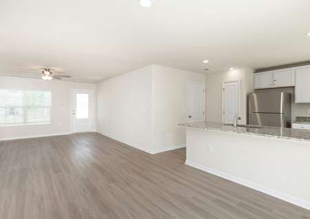 The living room is spacious with lots of natural light.