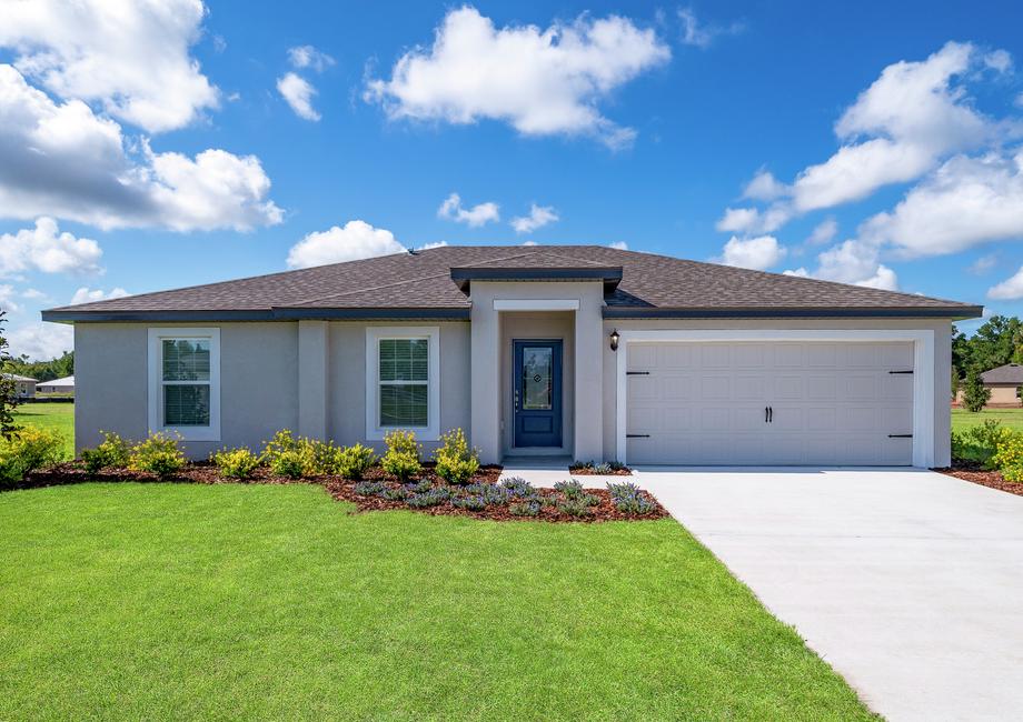 A beautiful house with landscaping and two-car garage.