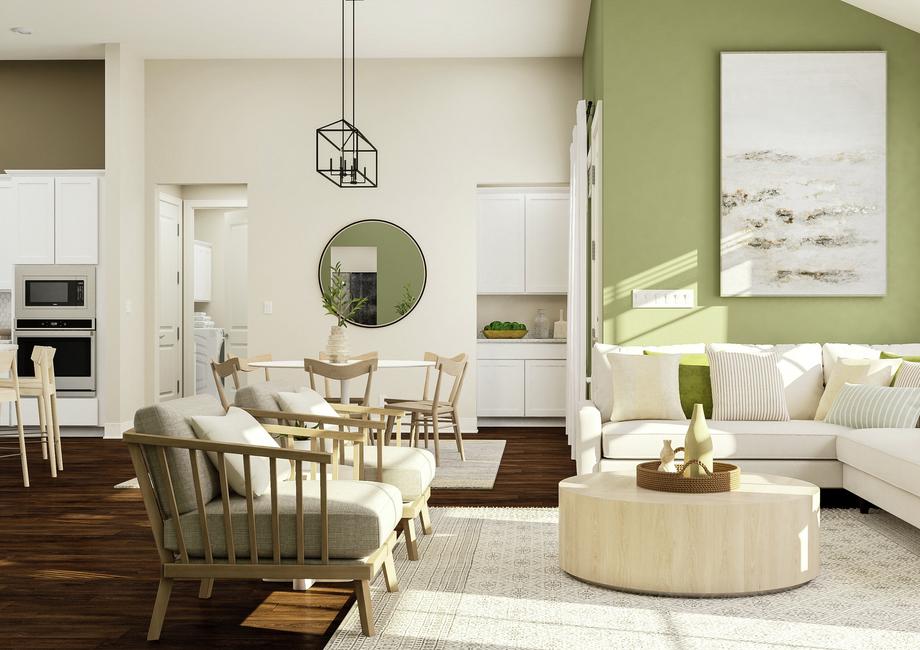 Rendering of living room area showing a
  white sectional couch along a green accent wall and large windows, a coffee
  table, accent chairs, and a view of the kitchen and dining space in the
  background with dark wood look flooring throughout.