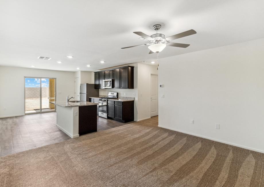 Open, efficient layout with the kitchen, dining area, and living room.