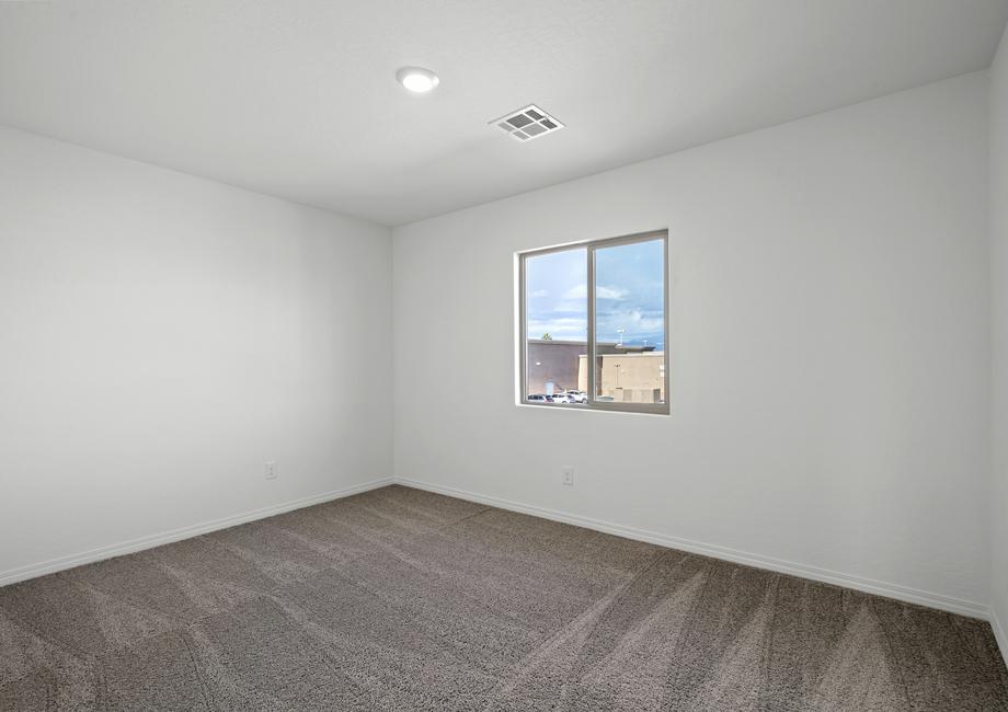 Secondary bedroom with carpet