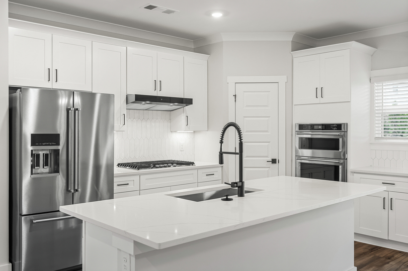 Gorgeous countertops and cabinets throughout. 