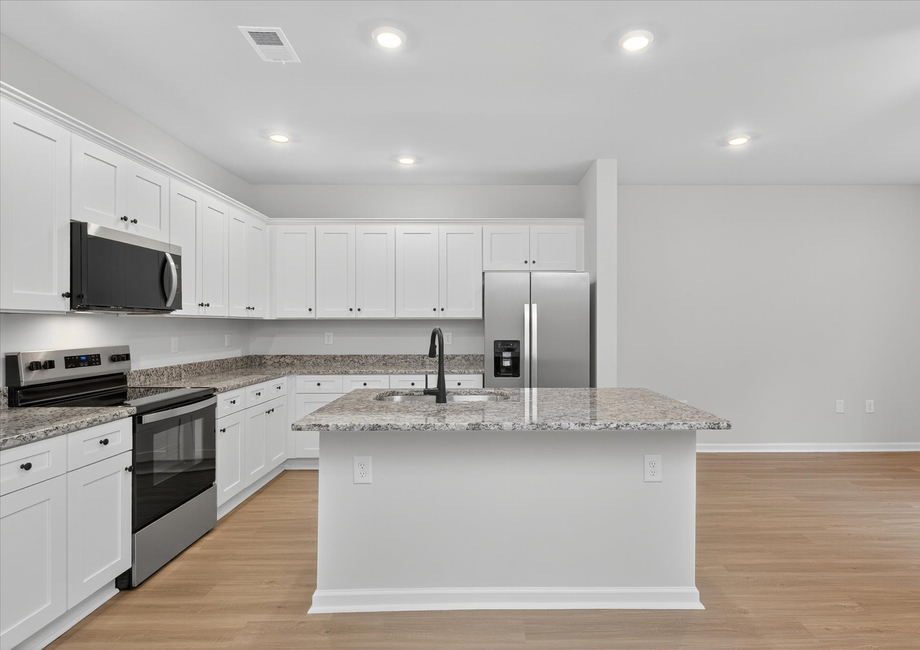 The kitchen has granite countertops. 