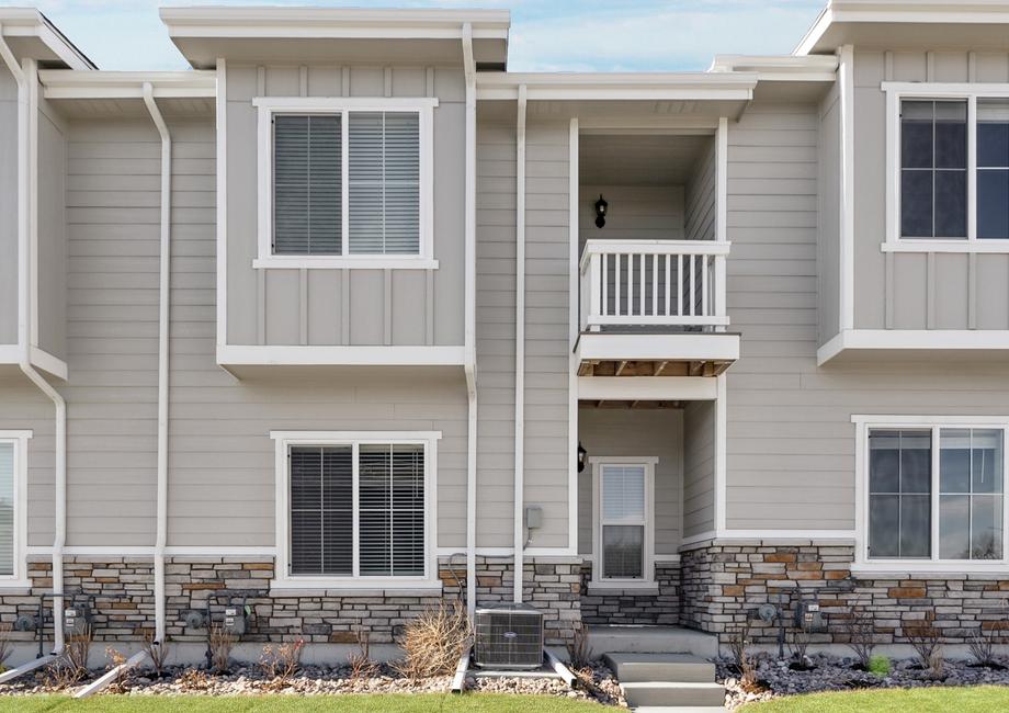 The Loveland is a beautiful two story home with siding.
