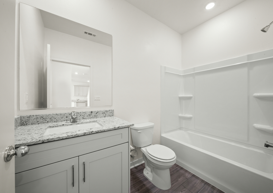 The secondary bathroom has a tub/shower combo.