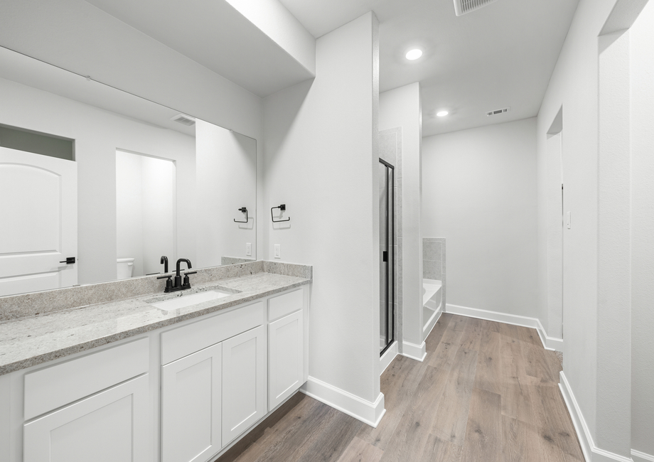 The master bathroom of the Driftwood has a large vanity space.