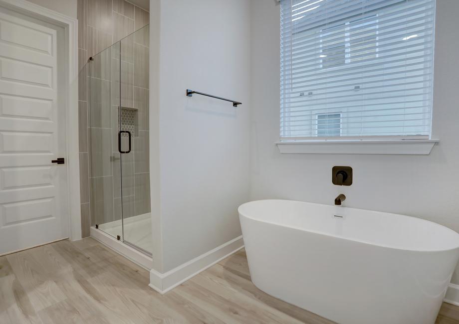 The master bath also features a soaking tub and walk-in shower.