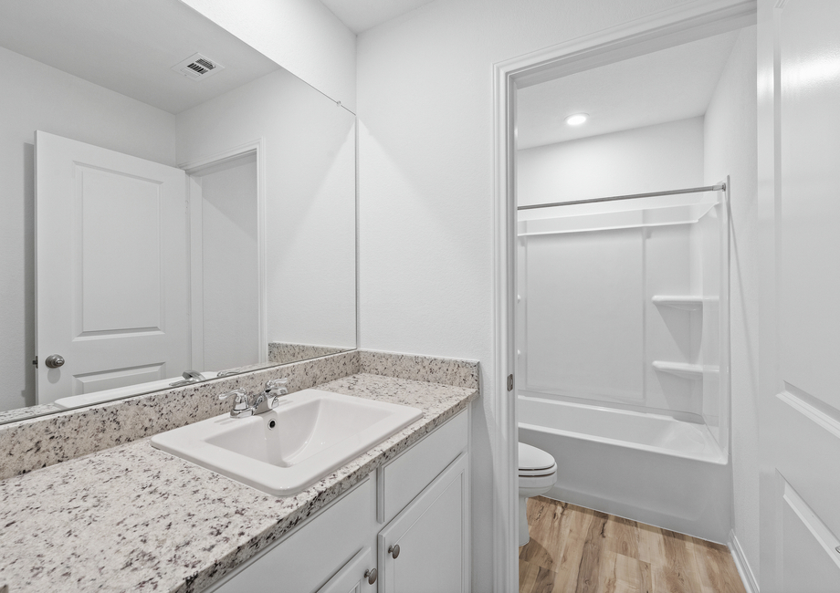 Secondary bathroom with a door to separate the sink