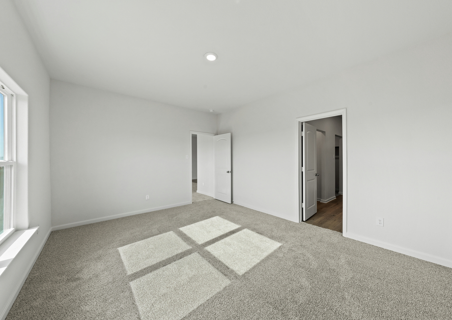 The master suite has a large bedroom, ensuite bathroom and a walk-in closet. 