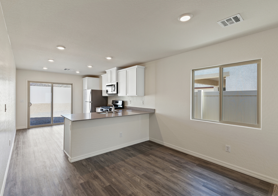 The dining room of the Aspen sits in between the kitchen and family room.