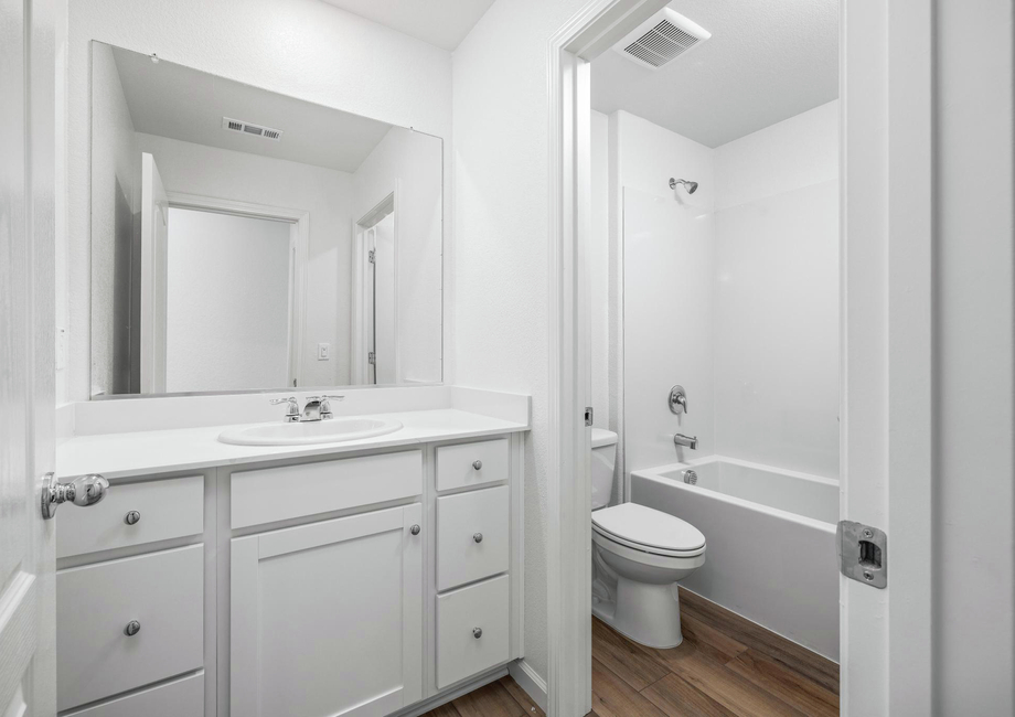 The secondary bathroom has a tub/shower combo.