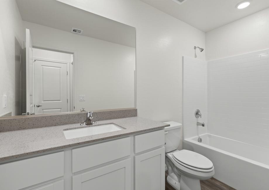 The secondary bathroom has a tub/shower combo.