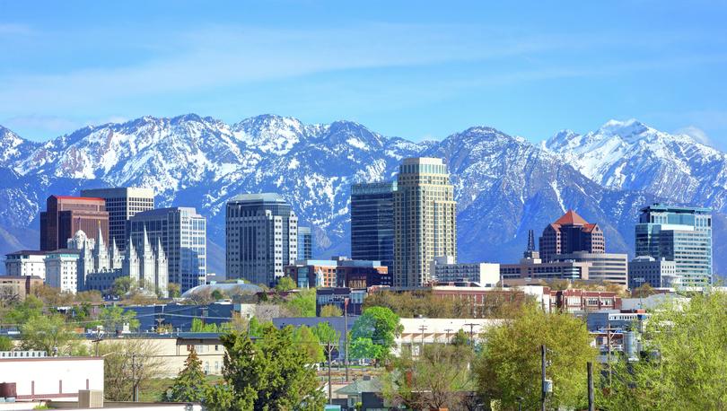 Salt Lake City skyline with mountains in the background.