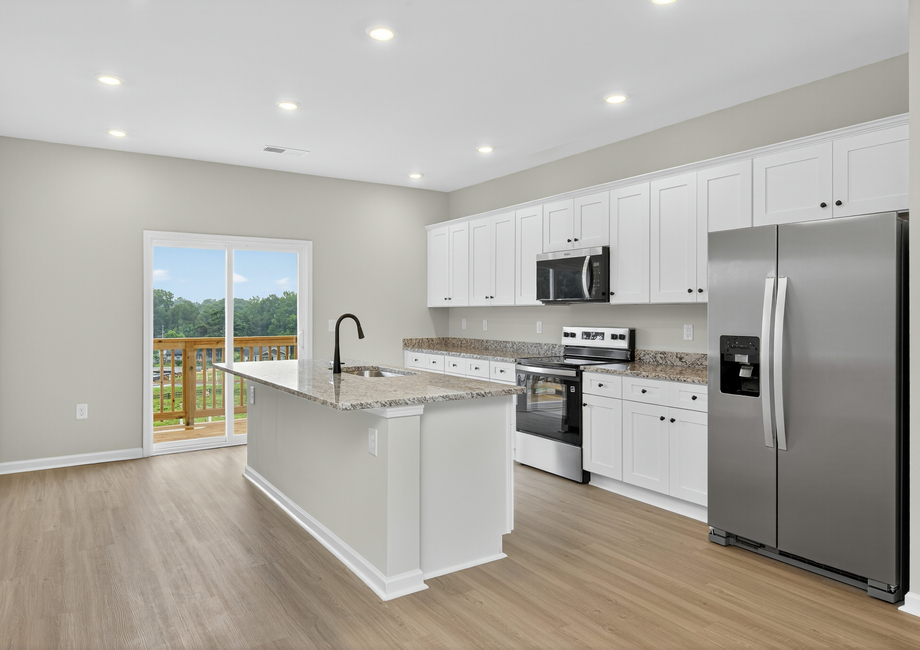 The kitchen has granite countertops. 
