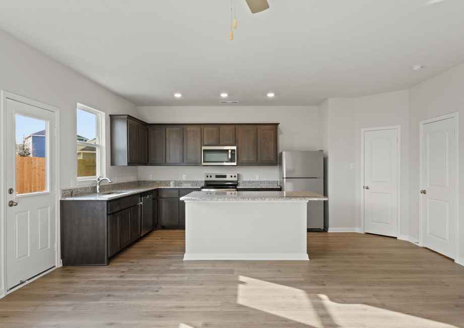 The kitchen has beautiful wood cabinets.