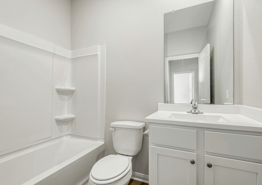 A tub/shower combination in the secondary bathroom