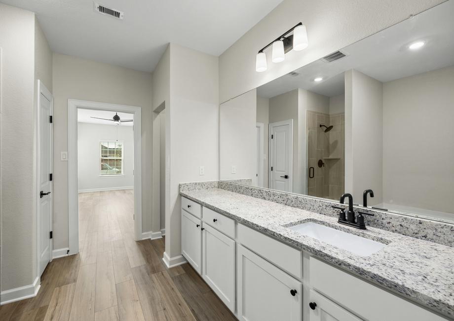 The master bathroom has plenty of storage.