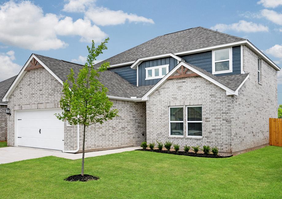 The Murray has a wonderful front yard and a large driveway that leads to a two-car garage.